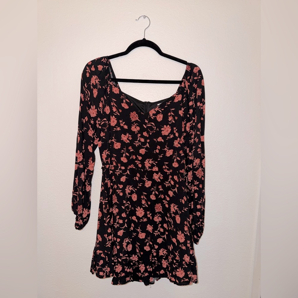 Emily Wonder black mini dress with coral/rose flowers.